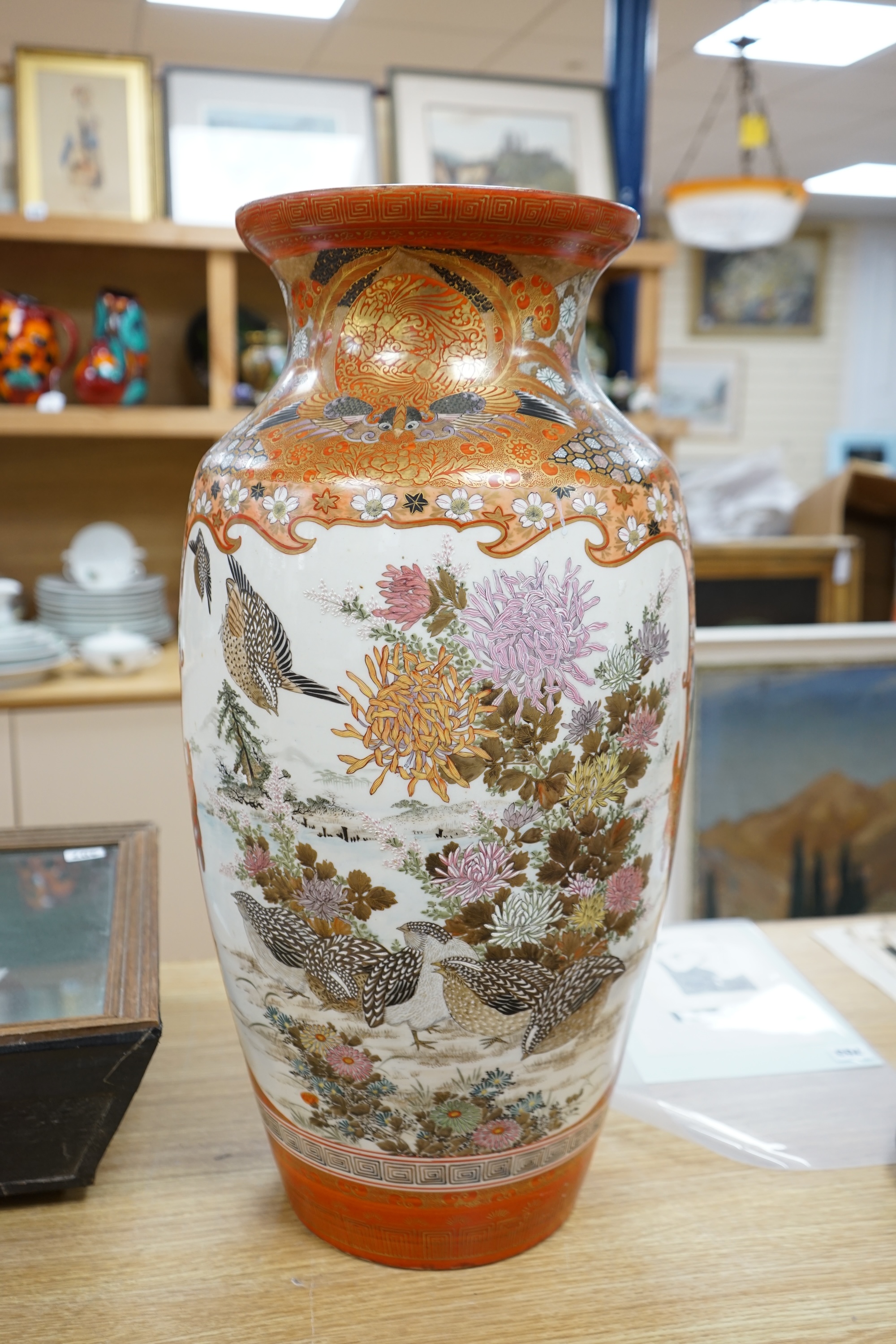 A massive Japanese kutani vase, hand painted with figures, quails and flowers, signed to the base, 61cm high. Condition - good